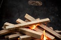 Starting the camp fire with kindling in a foldable firepit Royalty Free Stock Photo