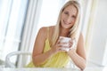 Starting the day off right. an attractive young woman drinking a coffee at home. Royalty Free Stock Photo