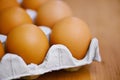 Starting the day right. Closeup shot of a carton of eggs on a table.