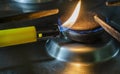 Starting a gas stove with a lighter Royalty Free Stock Photo