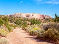 Starting the hike down Wire Pass at Wire Pass Trailhead in sunny autumn morning, Paria Canyon-Vermilion Cliffs Wilderness, near th