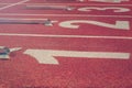 Starting line. Red running track with lane numbers. Sport Background. Royalty Free Stock Photo