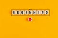 Starting a new beginning concept. The word new beginning on wooden cubes with a start button Royalty Free Stock Photo