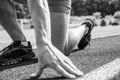 Starting point. Hand of sportsman on running track low start position. Runner ready to go close up. Ready steady go Royalty Free Stock Photo