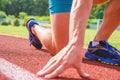 Starting point. Hand of sportsman on running track low start position. Runner ready to go close up. Ready steady go Royalty Free Stock Photo