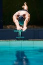 Starting the race. A young man diving off a starting block. Royalty Free Stock Photo