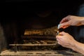 Starting up a fire inside a chimney with lighter cubes Royalty Free Stock Photo