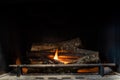 Starting up a fire inside a chimney Royalty Free Stock Photo