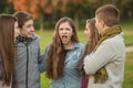 Startled Teens with Yelling Friend