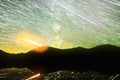 Startrails over alpine lake