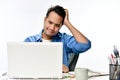 Startup business man looking stressed while working on a laptop Royalty Free Stock Photo