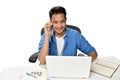 Startup business man smiling while talking on the phone and having fun at work Royalty Free Stock Photo