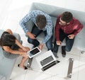 View from above of a group of people working with gadgets Royalty Free Stock Photo