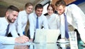 Startup business team on meeting in modern bright office interior and working on laptop Royalty Free Stock Photo