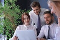 Startup business team on meeting in modern bright office interior and working on laptop Royalty Free Stock Photo