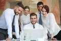 Startup business team on meeting in modern bright office interior and working on laptop Royalty Free Stock Photo