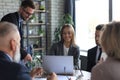 Startup business team on meeting in modern bright office interior and working on laptop Royalty Free Stock Photo