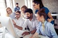 Startup business team on meeting in modern bright office interior brainstorming, working on computer Royalty Free Stock Photo