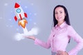 Startup concept. Business woman launches a rocket