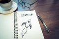 Startup concepts idea.rocket drawing on notepad.business investment Royalty Free Stock Photo