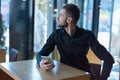 Startup Diversity Brainstorming  Concept.Woried  young Businessman waiting for results of Economy Report Document Laptop. Holding Royalty Free Stock Photo