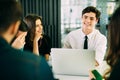 Startup diversity teamwork brainstorming meeting concept. People working planning start up. Group young people discussing in cafe. Royalty Free Stock Photo