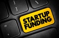 Startup Funding - act of raising capital to support a business venture, text concept button on keyboard Royalty Free Stock Photo