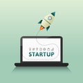 Startup launch concept with rocket and computer