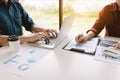 Startup people sitting together at office room table and balancing budget Royalty Free Stock Photo