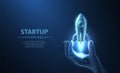 Startup. Rocket start from digital hand. Isolated on blue. Fast web development