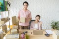 Startup small business owner at home . freelance couple seller check product order, packing goods for delivery to customer.