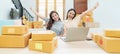 Startup small business owner working with computer at workplace. Freelance two woman seller check product order. Packing goods for Royalty Free Stock Photo