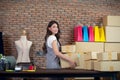Startup small business owner working at home, women seller holding cardboard boxes preparing for dispatching Royalty Free Stock Photo