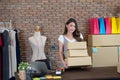 Startup small business owner working at home, women seller holding cardboard boxes preparing for dispatching Royalty Free Stock Photo