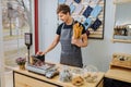 Startup small business people and service concept. happy female barman at counter with cashbox in cafe store checking Royalty Free Stock Photo