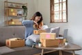 Startup small business, Young woman working freelance and packing box delivery products to customers, Ordered online Royalty Free Stock Photo