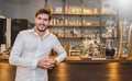 Startup successful small business entrepreneur owner man standing in his coffee shop or restaurant. Royalty Free Stock Photo