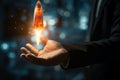 Startup symbol Hand ignites a rocket on a modern virtual interface Royalty Free Stock Photo