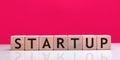 Startup word made with building blocks.