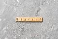 Startup word written on wood block. startup text on table, concept Royalty Free Stock Photo