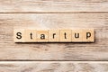 Startup word written on wood block. startup text on table, concept Royalty Free Stock Photo