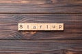 startup word written on wood block. startup text on table, concept Royalty Free Stock Photo