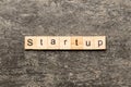 startup word written on wood block. startup text on table, concept Royalty Free Stock Photo