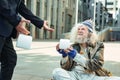 Starving fugitive feeling happy while getting food box