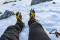 Crampons on boots required equipment for hard frozen snow on steep slopes in the mountains