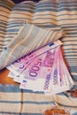 Stash of euros cash in ancient furniture at home. Money is hidden in an old sofa paneling