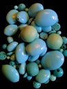 Stash of turqoise globular beads stacked in a pile