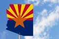 State of Arizona road sign in the shape of the state map with the flag Royalty Free Stock Photo