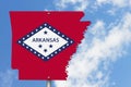 State of Arkansas road sign in the shape of the state map with the flag Royalty Free Stock Photo