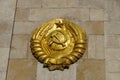 State emblem of the former Union of Soviet Socialist Republics depicting a hammer and sickle